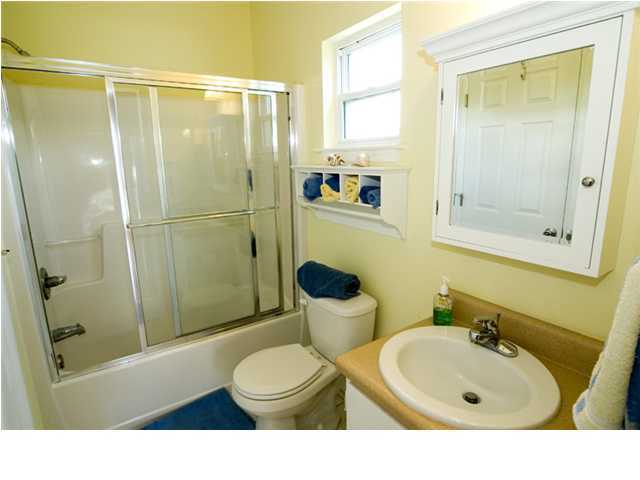 9 Blue Crab Loop Seacrest, FL 32461 - Photo 26 of 28 a bathroom with a sink a toilet and shower