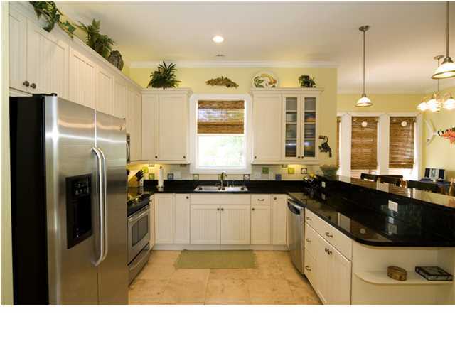 9 Blue Crab Loop Seacrest, FL 32461 - Photo 4 of 28 a kitchen with stainless steel appliances granite countertop a sink a stove and a refrigerator