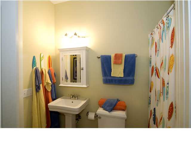 9 Blue Crab Loop Seacrest, FL 32461 - Photo 9 of 28 a bathroom with a sink a mirror and a shower curtain