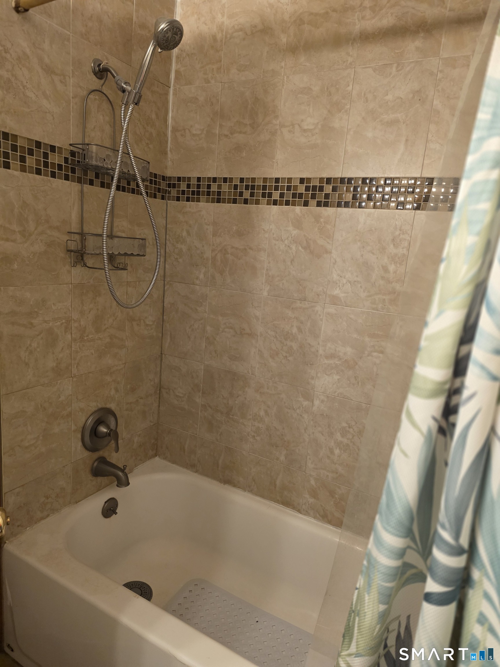 22 Lakeview Street, Unit 1 East Hampton, CT 06424 - Photo 12 of 20 a bath tub sitting next to a white sink and a wooden floor