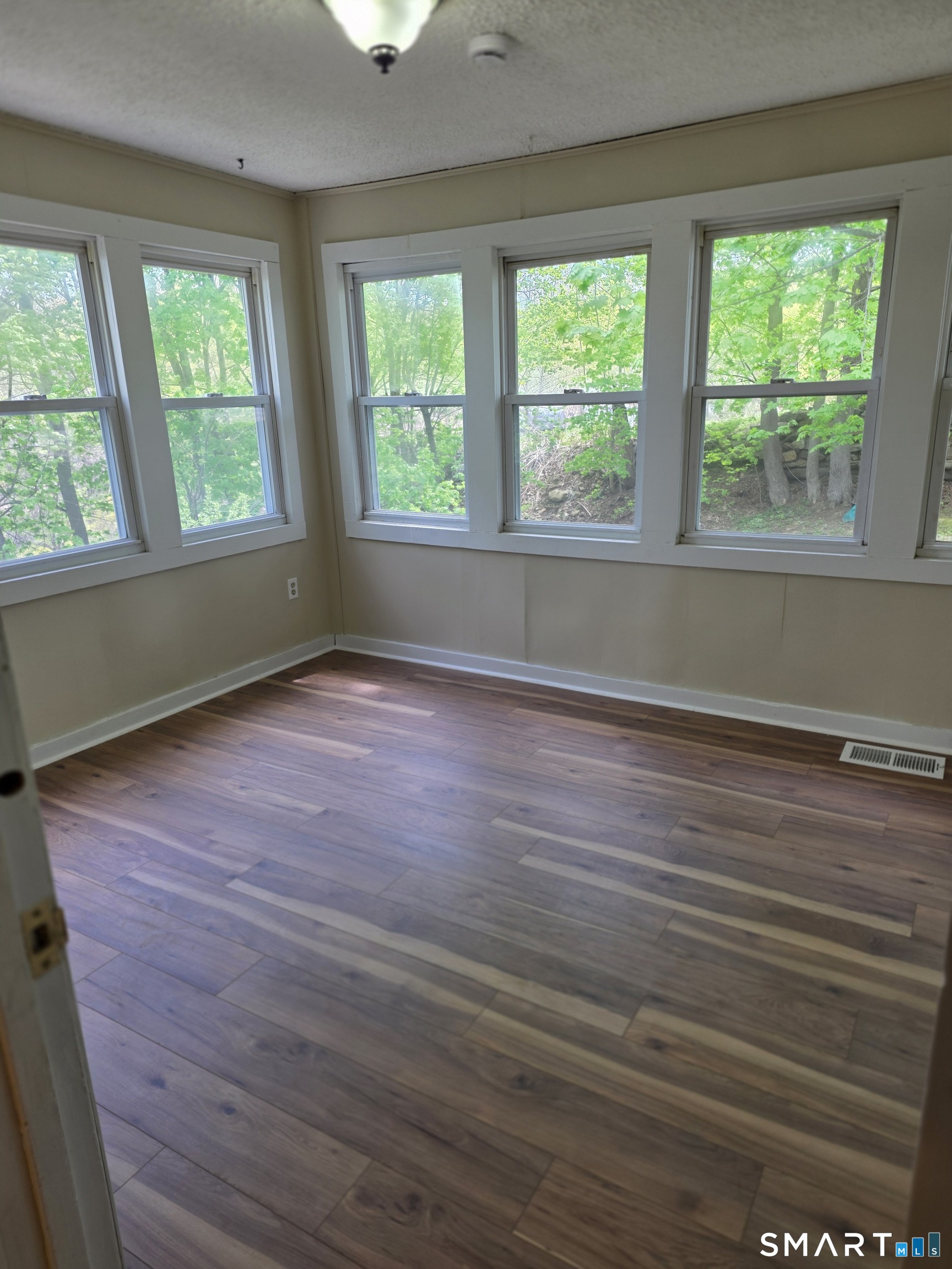 22 Lakeview Street, Unit 1 East Hampton, CT 06424 - Photo 14 of 20 a view of room with window and hardwood floor
