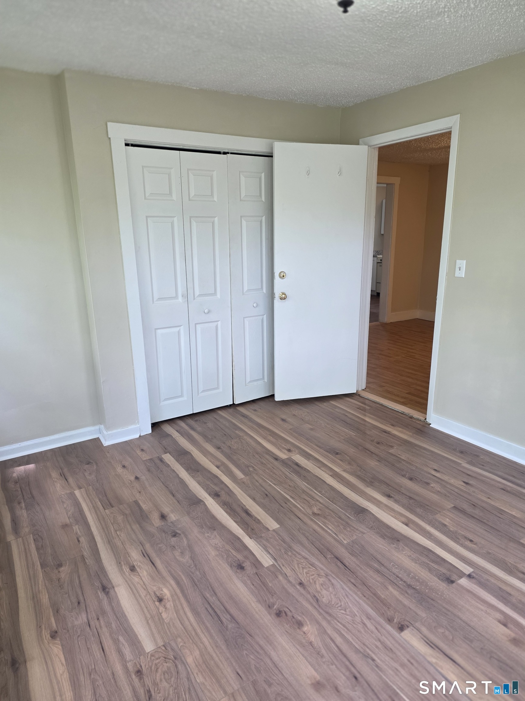 22 Lakeview Street, Unit 1 East Hampton, CT 06424 - Photo 15 of 20 a view of empty room with wooden floor
