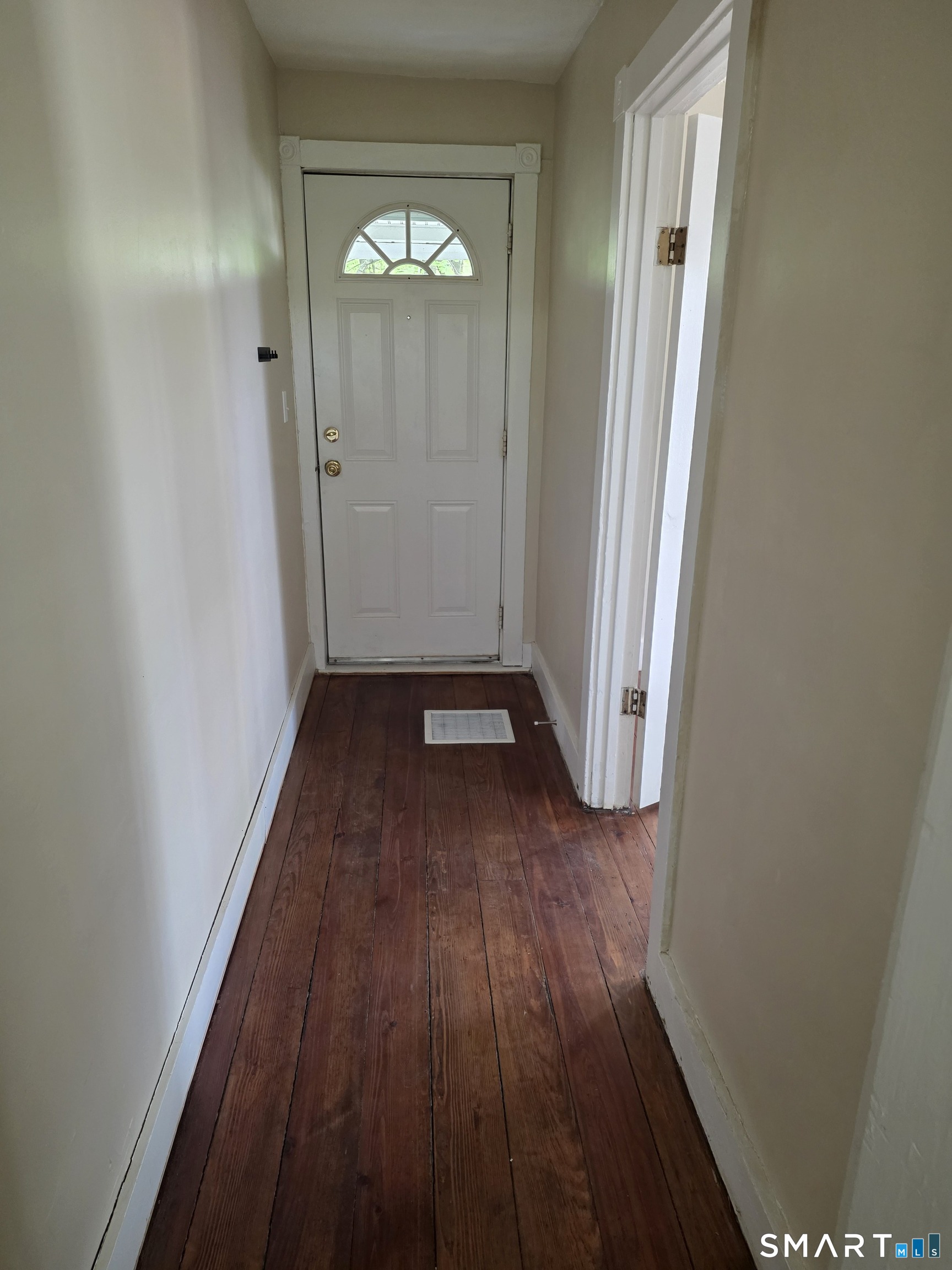 22 Lakeview Street, Unit 1 East Hampton, CT 06424 - Photo 3 of 20 an empty room with wooden floor and windows