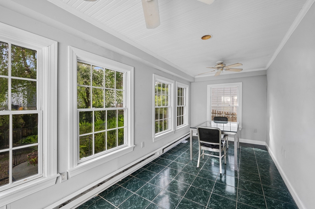 26 Pickwick Road Marblehead, MA 01945 - Photo 18 of 40 a dining room with a table and chairs next to a window