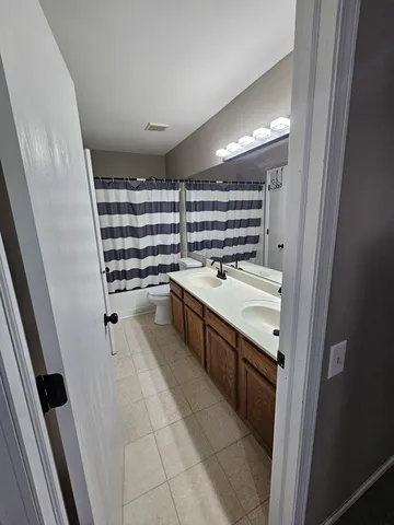 a kitchen with a sink and refrigerator