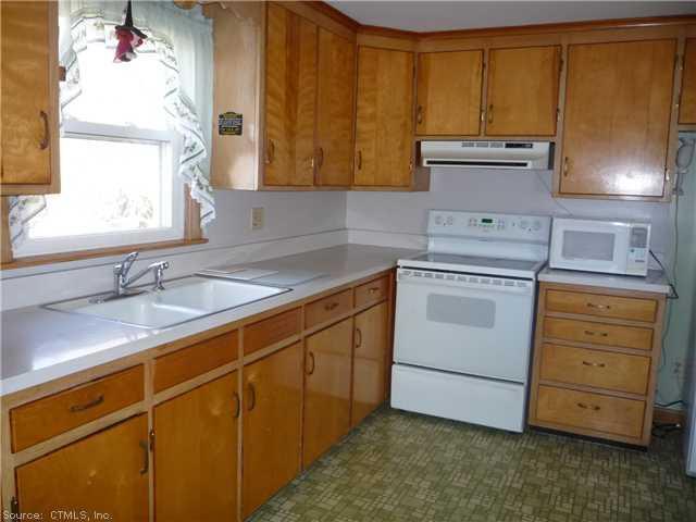 a kitchen with sink a cabinets and window