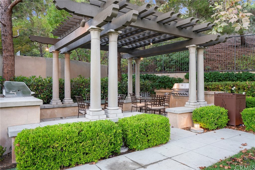 61 Bellwind Irvine, CA 92603 - Photo 14 of 17 a front view of a house with garden and porch
