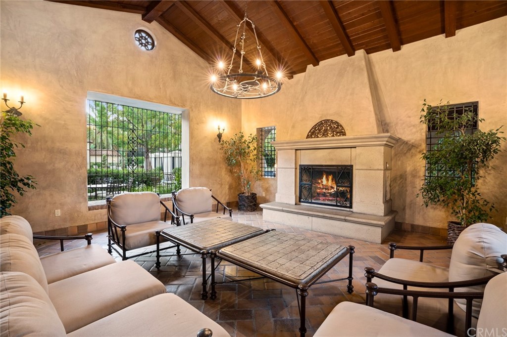 61 Bellwind Irvine, CA 92603 - Photo 17 of 17 a living room with furniture a window and a fireplace