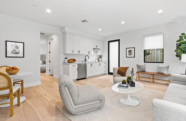 a living room with furniture and a lamp