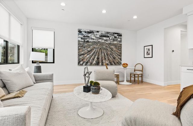 a view of a couches in patio of back yard