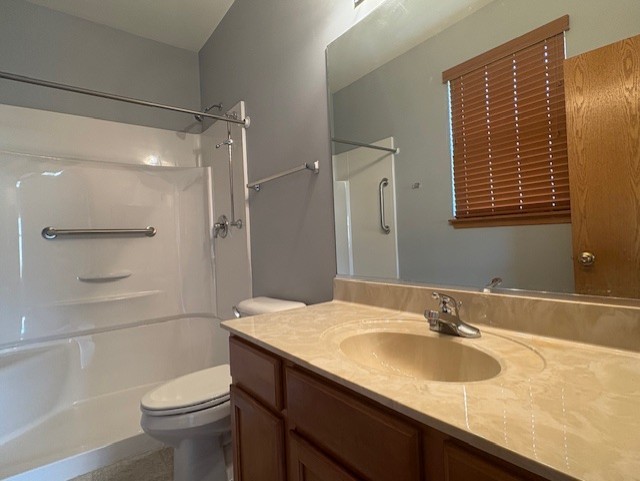 211 Leah Court Sycamore, IL 60178 - Photo 14 of 29 a bathroom with a sink a toilet and shower