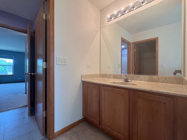 211 Leah Court Sycamore, IL 60178 - Photo 18 of 29 a bathroom with a double vanity sink and a mirror