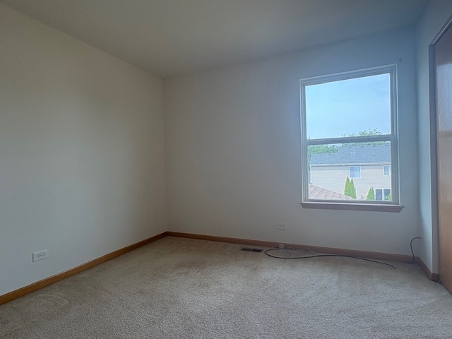 211 Leah Court Sycamore, IL 60178 - Photo 21 of 29 an empty room with a window