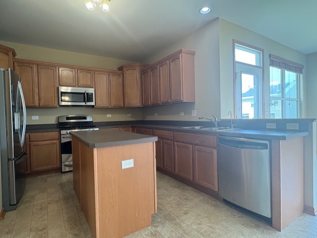 211 Leah Court Sycamore, IL 60178 - Photo 5 of 29 a kitchen with granite countertop a refrigerator stove top oven and sink