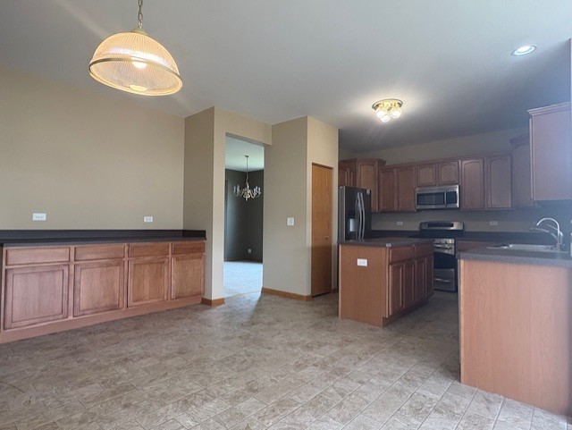 211 Leah Court Sycamore, IL 60178 - Photo 6 of 29 a kitchen with stainless steel appliances granite countertop a refrigerator a sink a stove a microwave oven with white cabinets