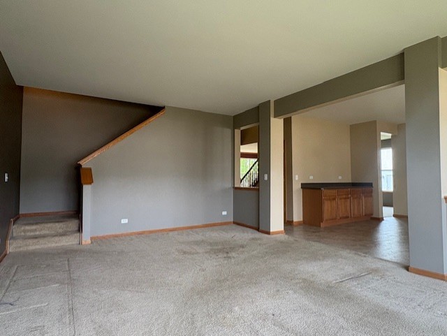 211 Leah Court Sycamore, IL 60178 - Photo 9 of 29 an empty room with windows and cabinet