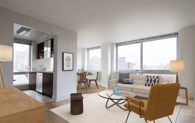 a living room with furniture and a large window