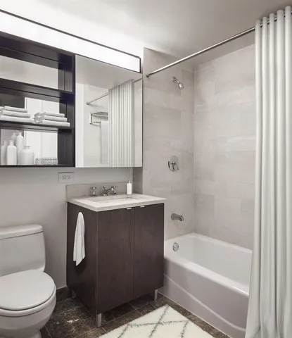 a bathroom with a sink a toilet and a bathtub
