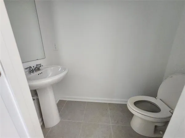 a bathroom with a sink and vanity