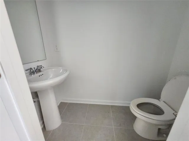 a bathroom with a sink and vanity