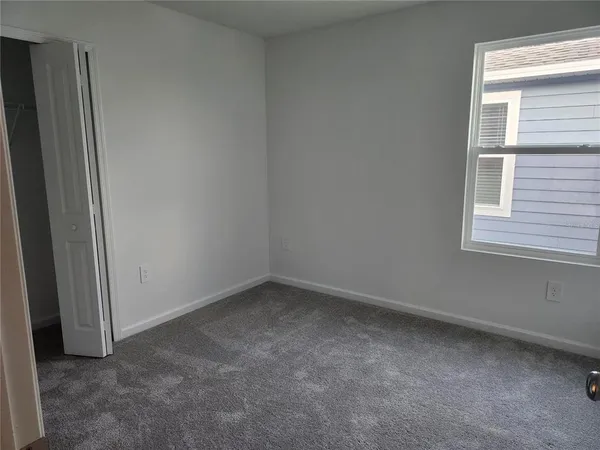 a view of a hallway with closet