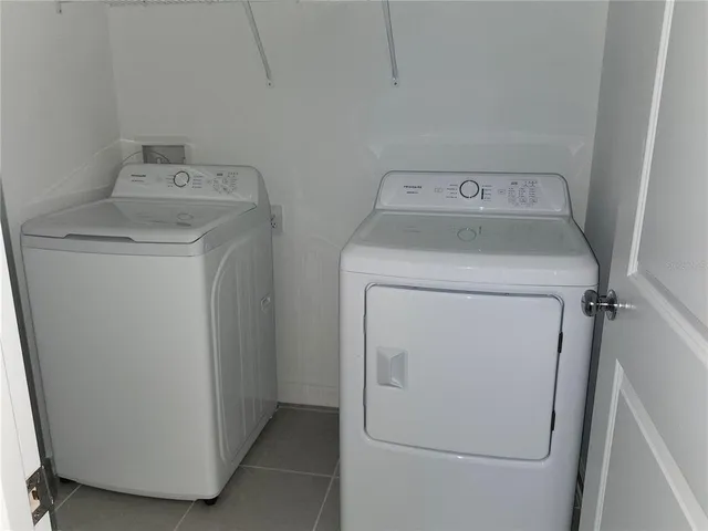 a view of backyard of house with green space