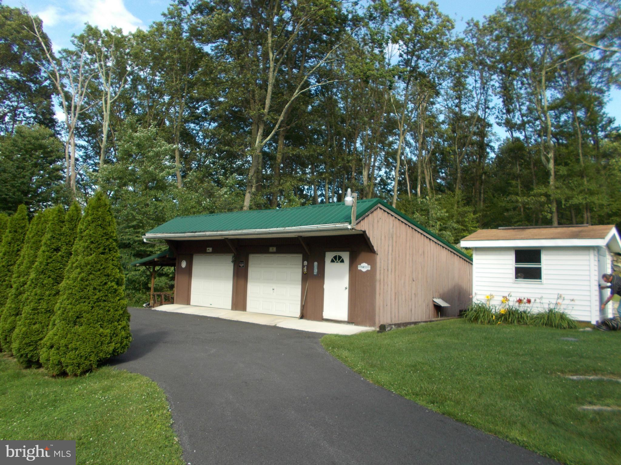 24850 Pen Mar Road Cascade, MD 21719 - Photo 3 of 27 a front view of house with yard and trees