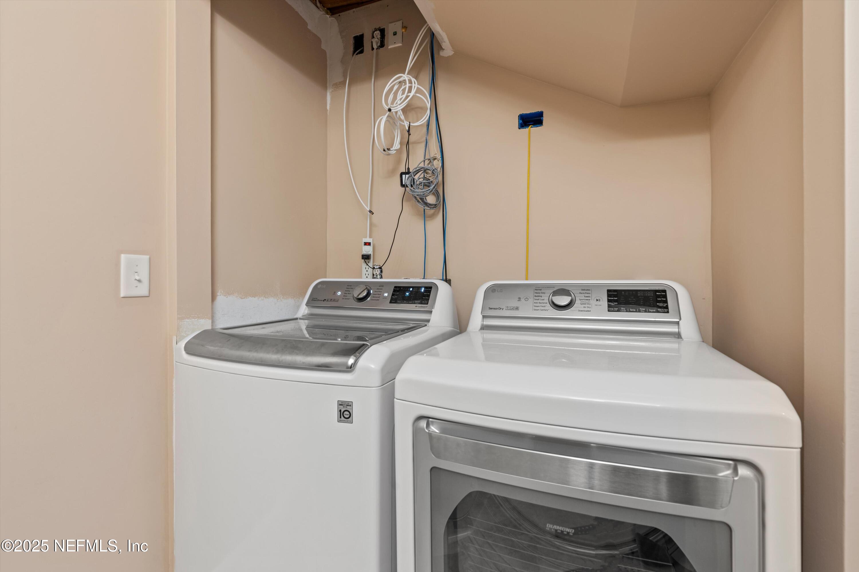 4807 Evenlode Lane Jacksonville, FL 32217 - Photo 19 of 28 a utility room with dryer and washer