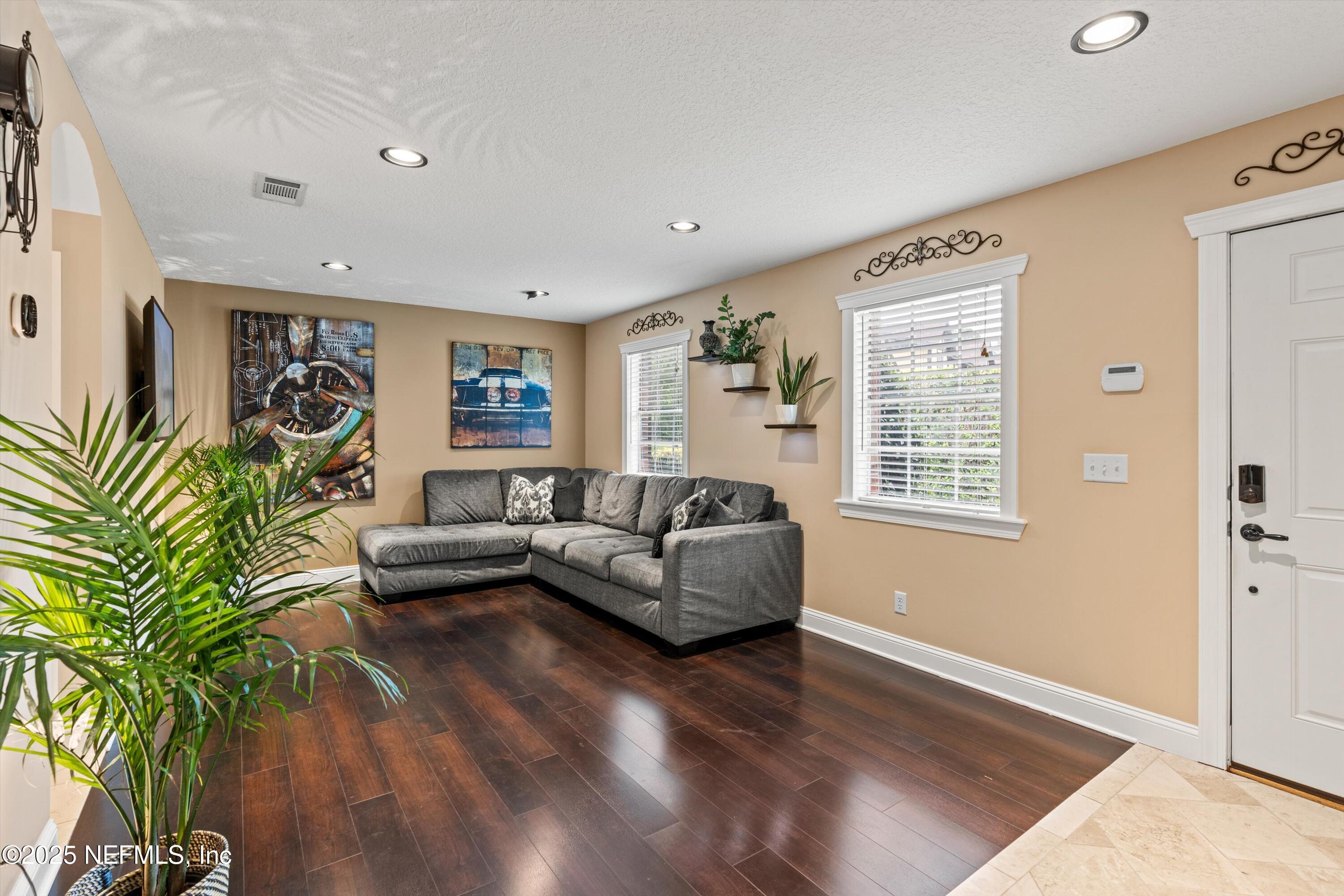4807 Evenlode Lane Jacksonville, FL 32217 - Photo 3 of 28 a living room with furniture and a potted plant