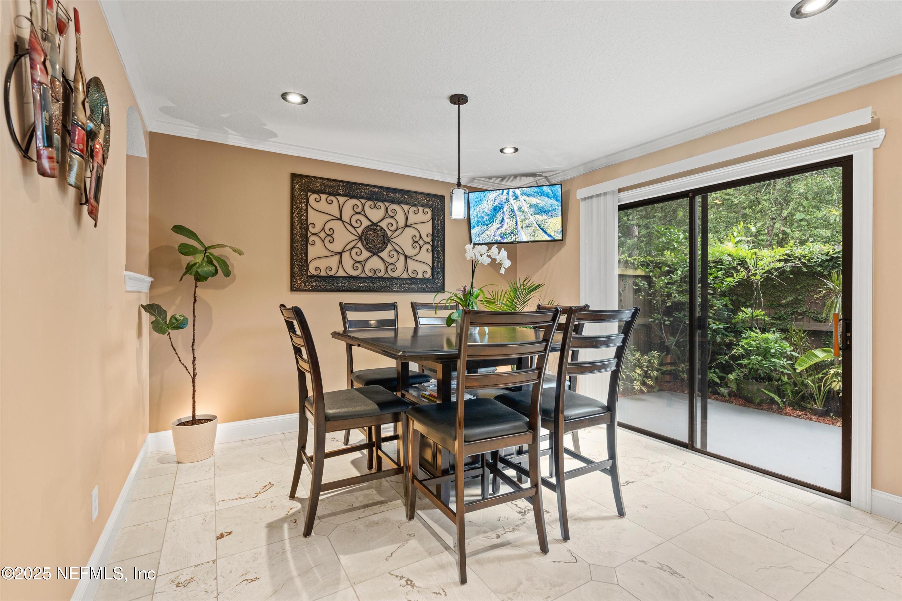 4807 Evenlode Lane Jacksonville, FL 32217 - Photo 5 of 28 a view of a dining room with furniture window and outside view