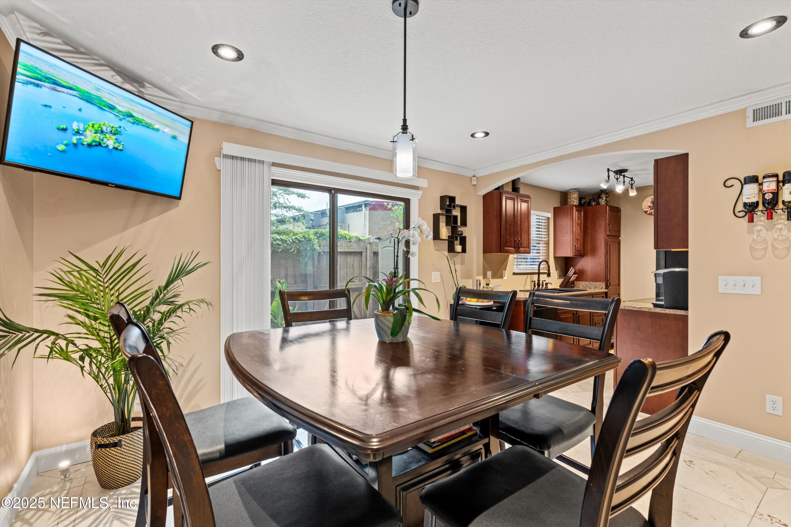 4807 Evenlode Lane Jacksonville, FL 32217 - Photo 6 of 28 a dining room with furniture and window