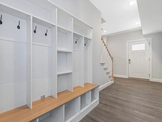 a view of room with wooden floor and window