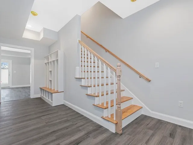 a view of entryway with wooden floor
