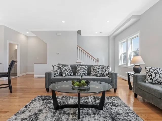 a living room with furniture and a table