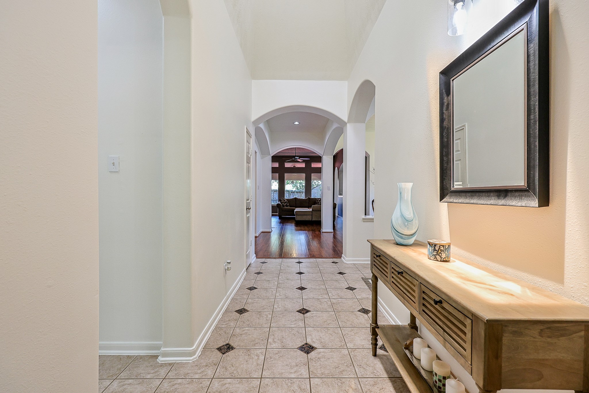 10306 Rudolph Court Missouri City, TX 77459 - Photo 6 of 34 A light filled foyer immediately captivates your guests with a luminous overhead skylight.