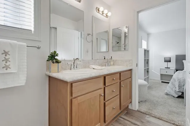 a spacious bathroom with a double vanity sink mirror and