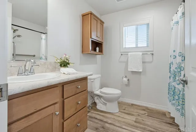 a bathroom with a shower curtain and a shower curtain