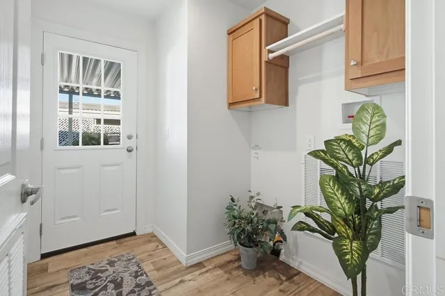 a front view of a house with porch and seating space