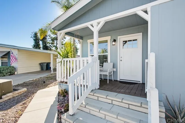 a view of a dining room with furniture and window