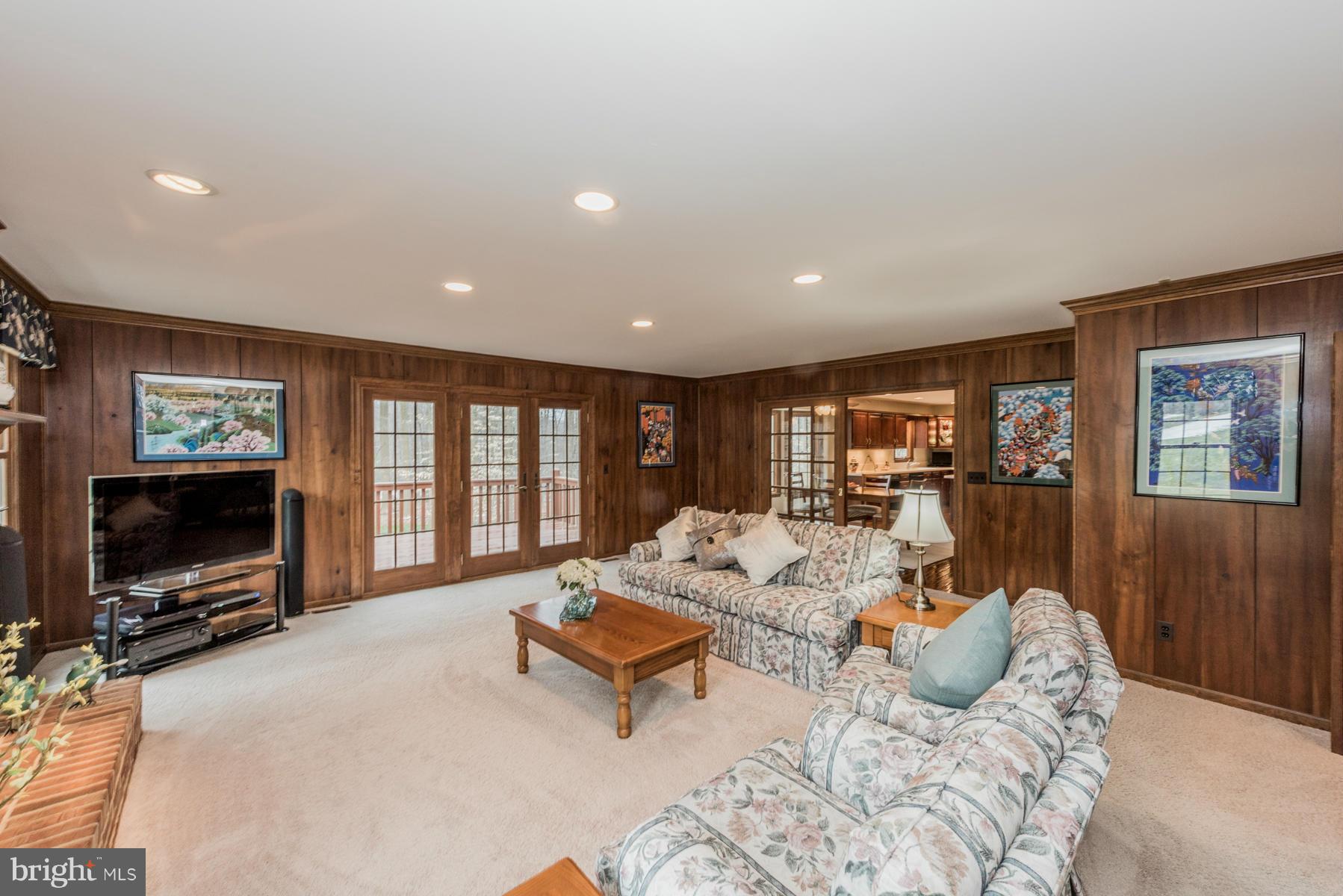 5 Wetherbee Court Phoenix, MD 21131 - Photo 13 of 29 a living room with furniture a flat screen tv and a fireplace