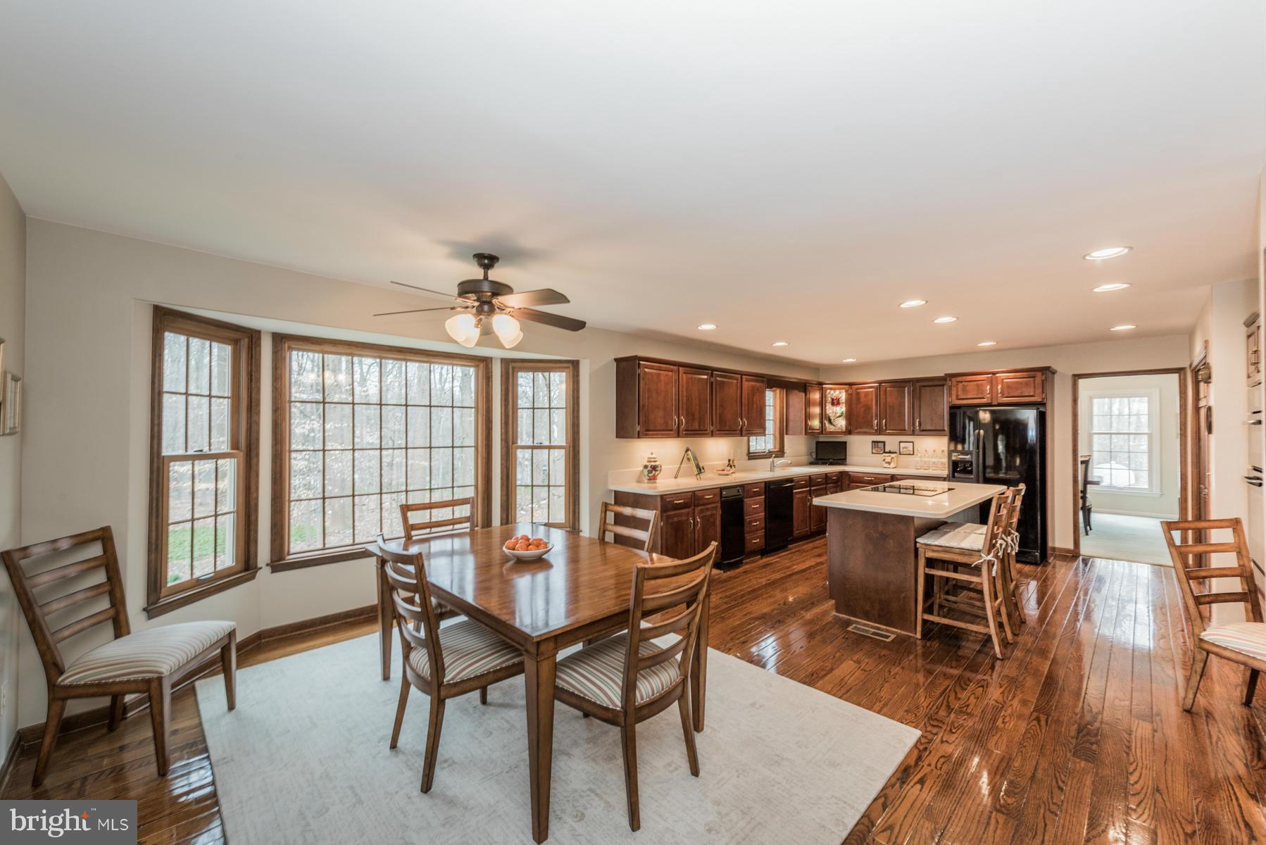 5 Wetherbee Court Phoenix, MD 21131 - Photo 14 of 29 a view of a dining room with furniture and wooden floor