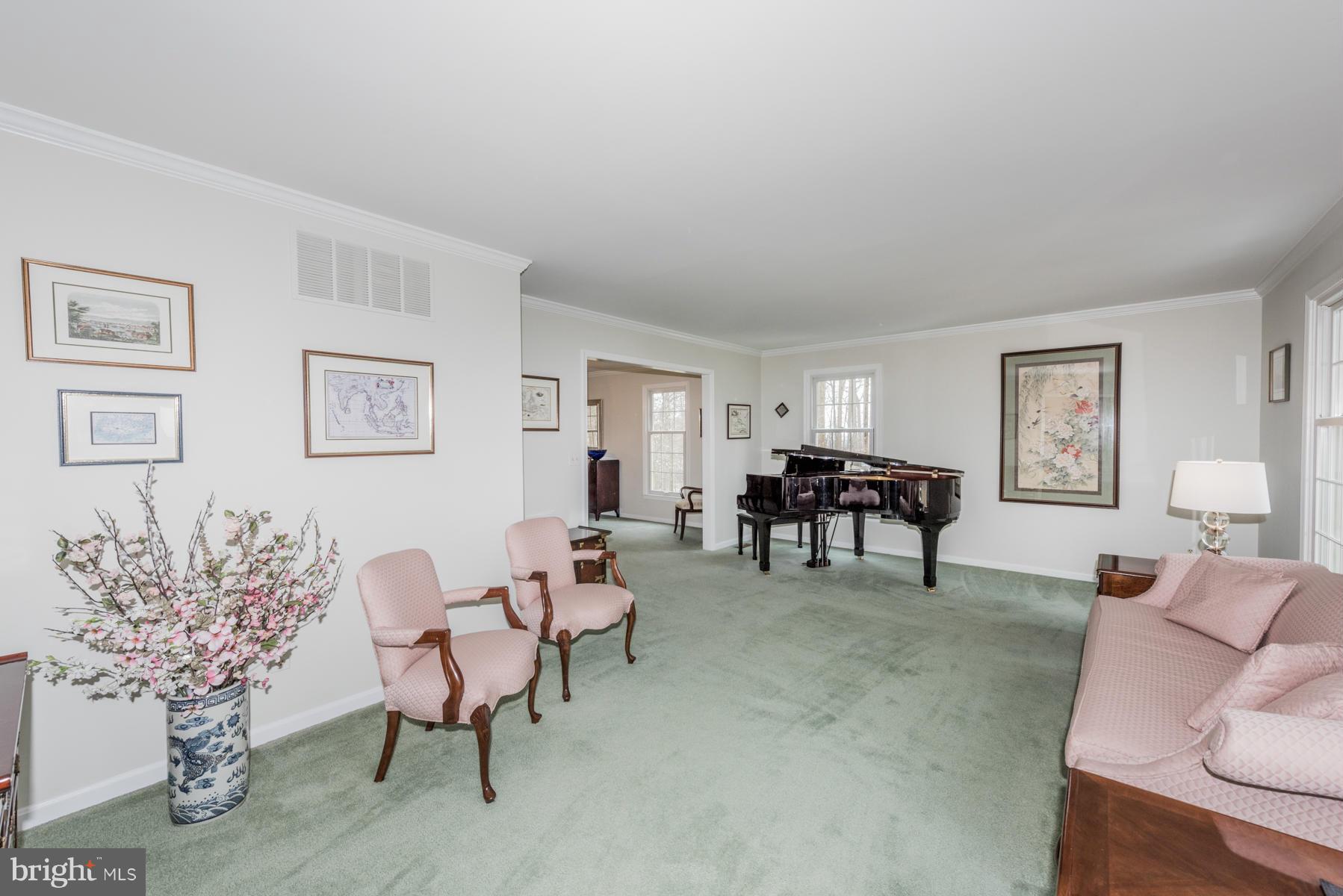 5 Wetherbee Court Phoenix, MD 21131 - Photo 15 of 29 a living room with furniture and a dining table with chair