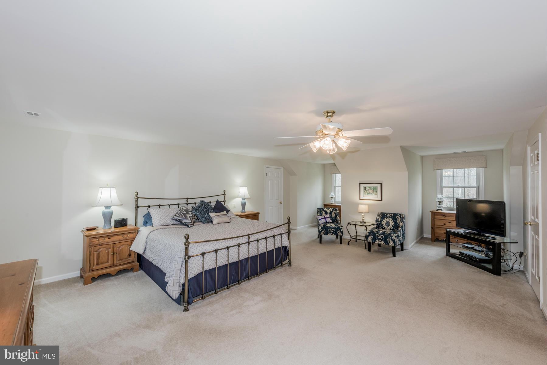 5 Wetherbee Court Phoenix, MD 21131 - Photo 19 of 29 a bedroom with a bed and a chandelier