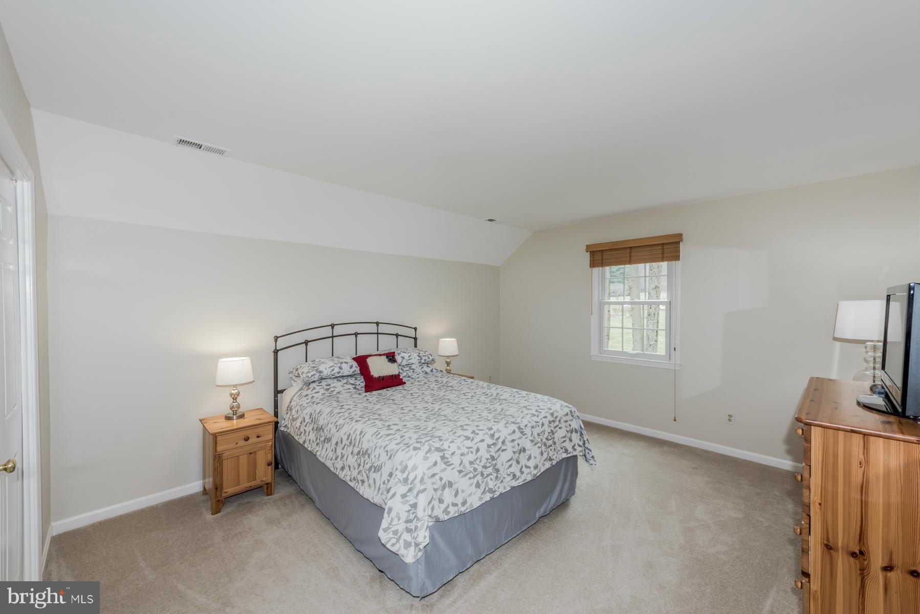 5 Wetherbee Court Phoenix, MD 21131 - Photo 21 of 29 a bedroom with a bed and a tv on the dresser