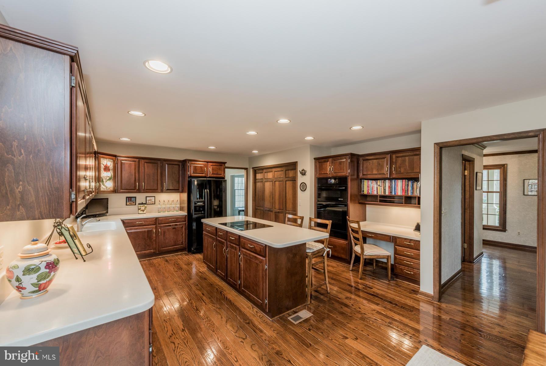 5 Wetherbee Court Phoenix, MD 21131 - Photo 6 of 29 a large living room with stainless steel appliances kitchen island granite countertop furniture and a kitchen view