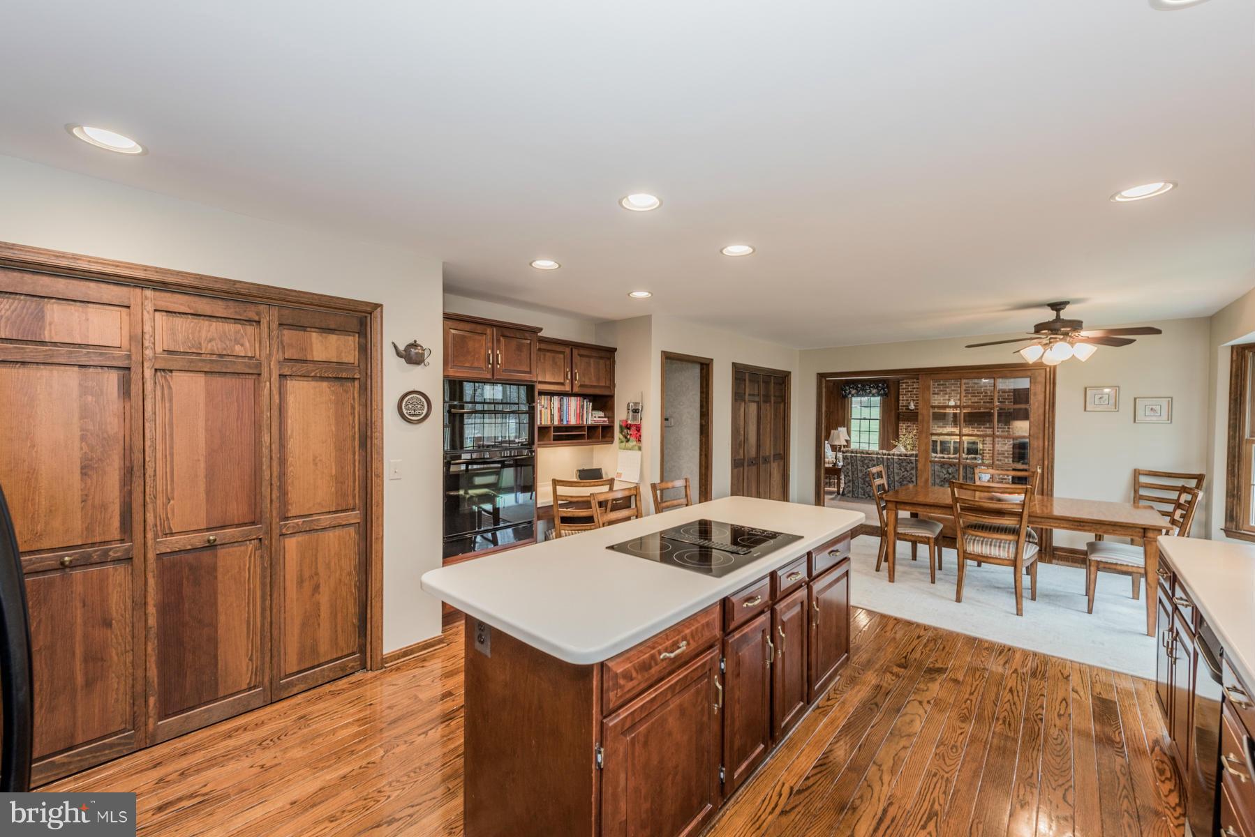 5 Wetherbee Court Phoenix, MD 21131 - Photo 7 of 29 an open kitchen with a table and chairs