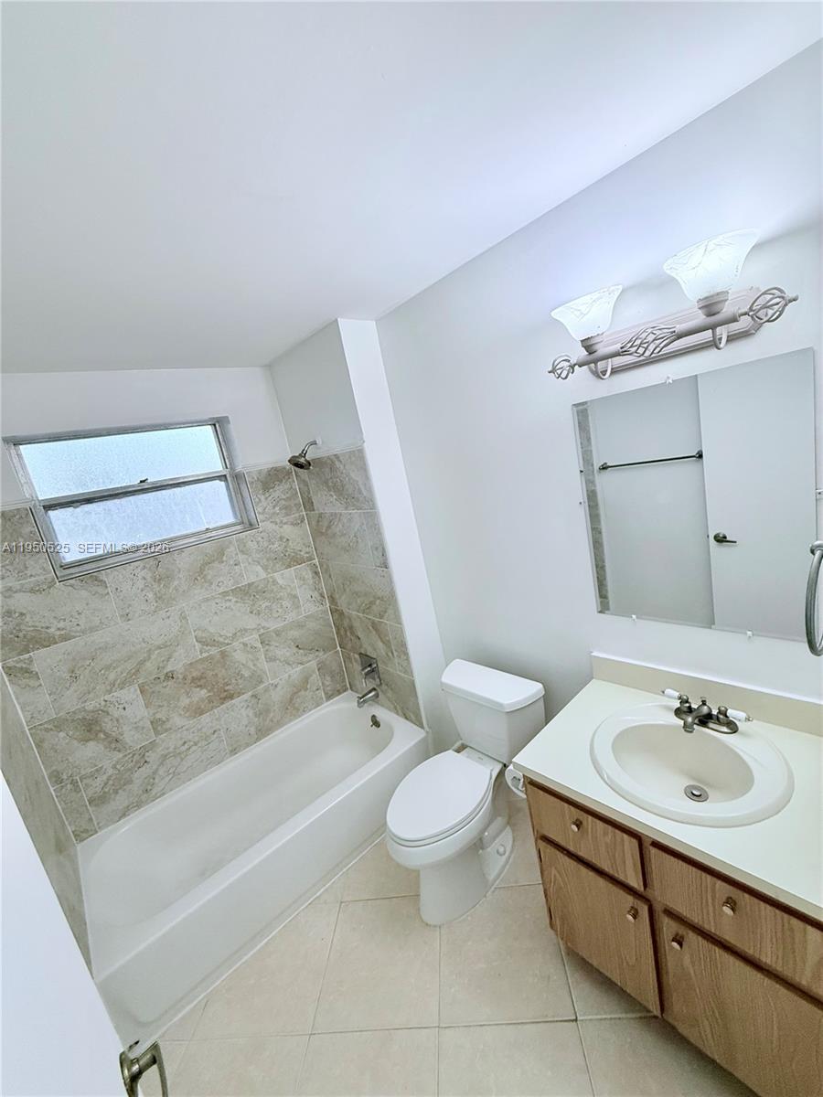 22279 Woodborn Drive Boca Raton, FL 33428 - Photo 11 of 19 a bathroom with a sink a toilet and shower