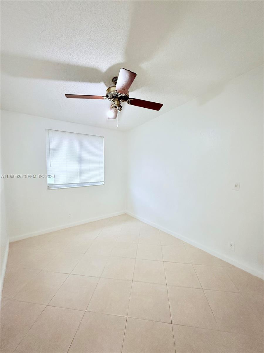 22279 Woodborn Drive Boca Raton, FL 33428 - Photo 12 of 19 a view of an empty room with a window