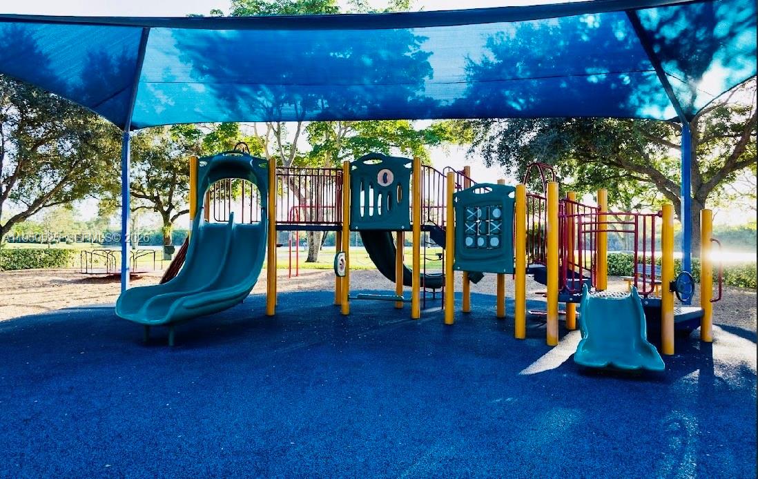 22279 Woodborn Drive Boca Raton, FL 33428 - Photo 19 of 19 a view of a swimming pool with seating area