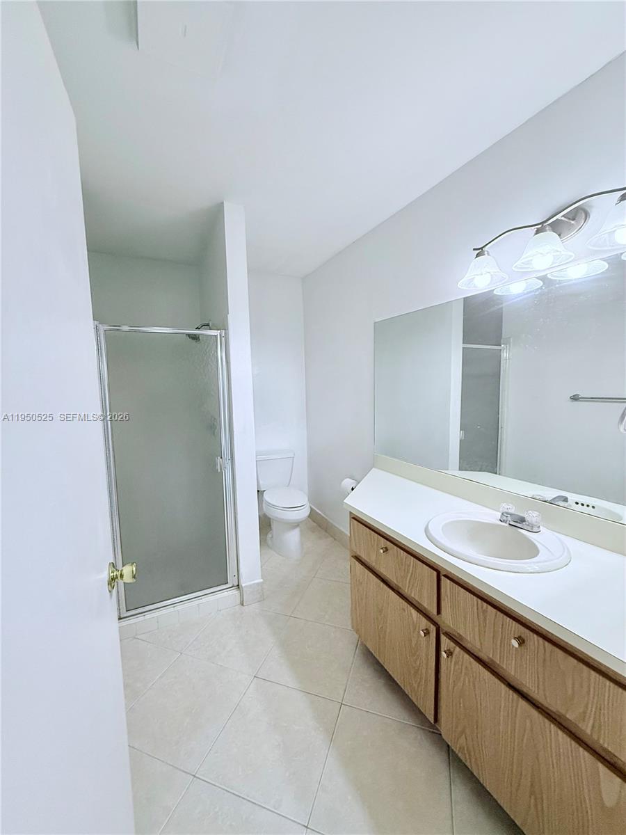 22279 Woodborn Drive Boca Raton, FL 33428 - Photo 9 of 19 a bathroom with a sink and a mirror